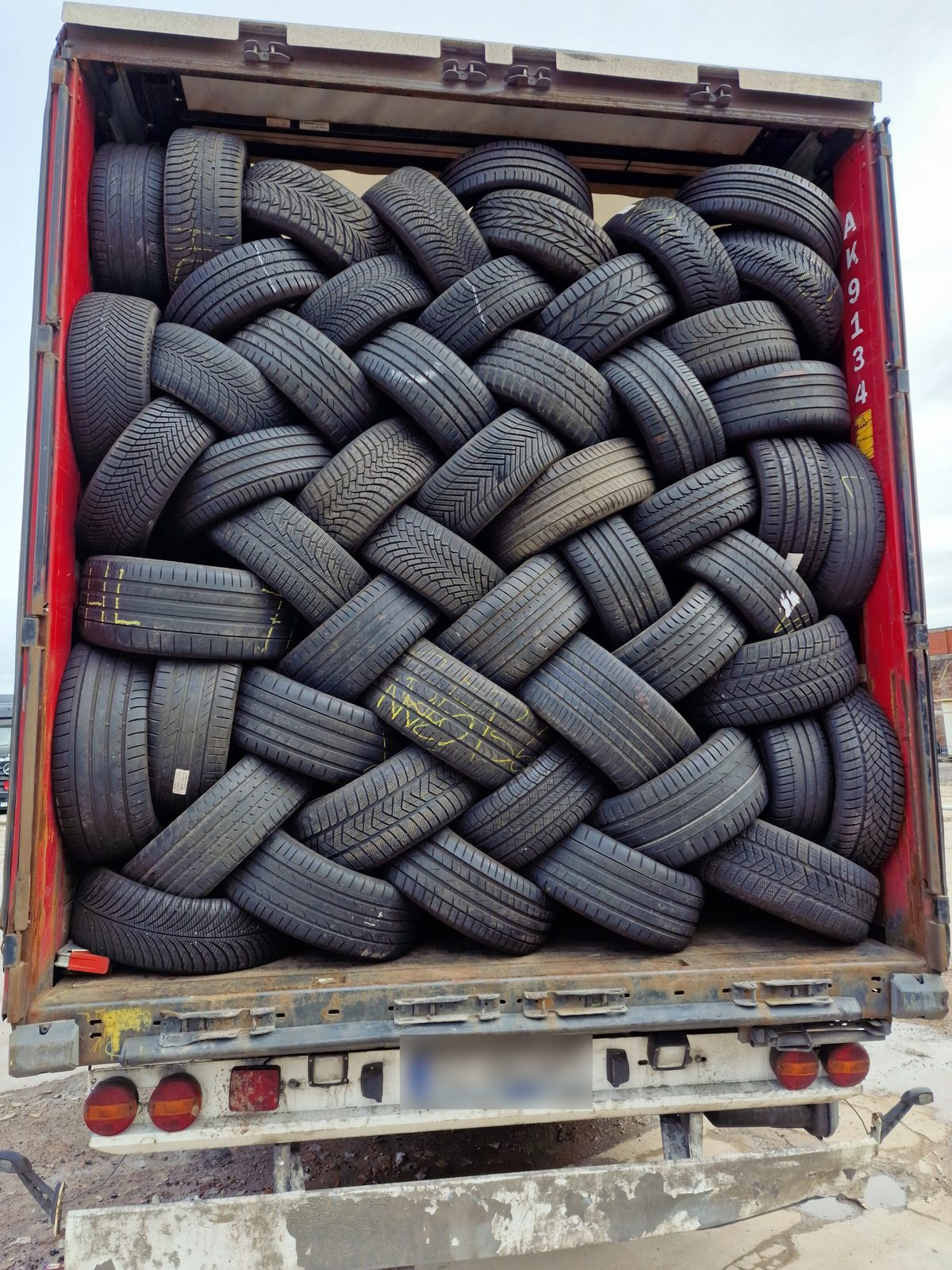 A trailer packed with part worn tyres arriving at the yard